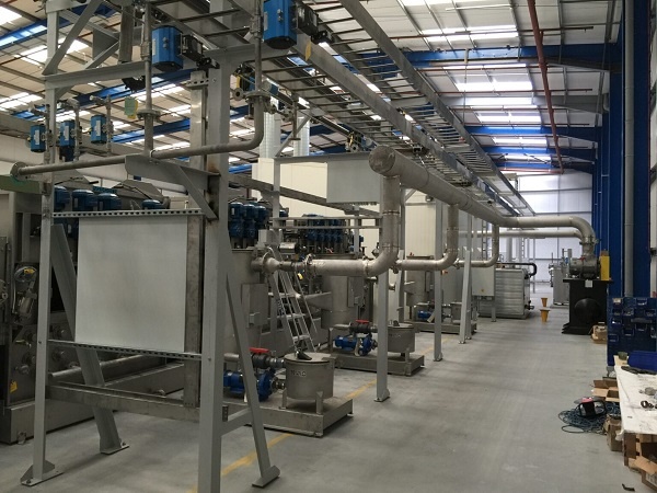 Photograph of the scouring line where we added a process filtration solution using a stainless steel filter housing.